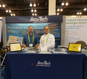 Photo of Accu-Tech Laser team members in our booth at the imaps show